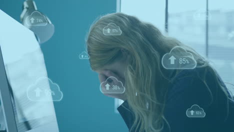 animation of arrow and changing number in clouds over tired caucasian woman in office