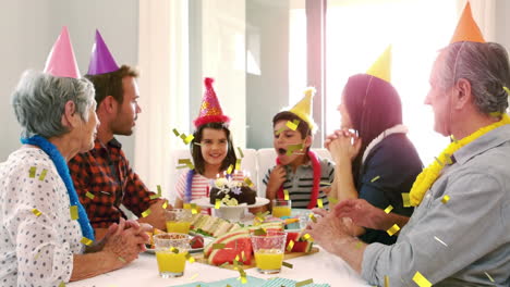 animation of confetti falling over family having fun at birthday party