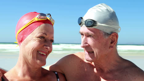 senior couple interacting with each other at the beach