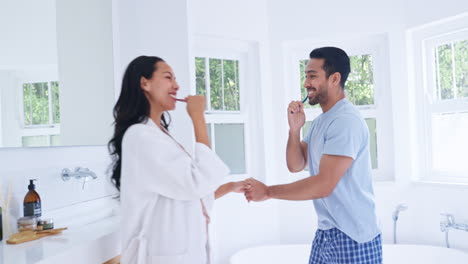 Home,-bathroom-or-couple-brushing-teeth