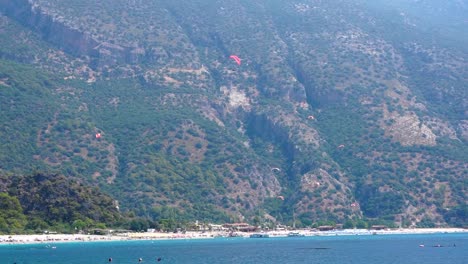 paragliders flying in oludeniz, turquoise coast, turkey