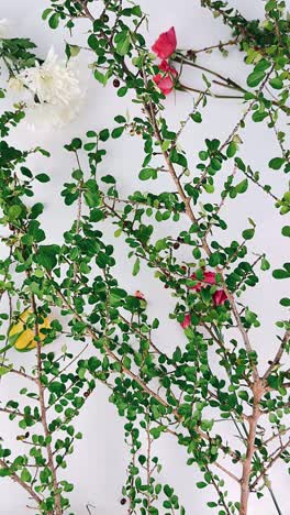 floral arrangement with branches and flowers