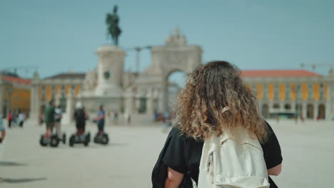 woman in lisbon's praca do comercio