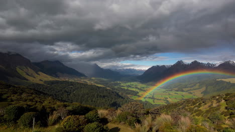 rainbow over a scenic mountain valley landscape