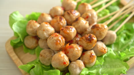 grilled meatballs skewer with spicy dipping sauce