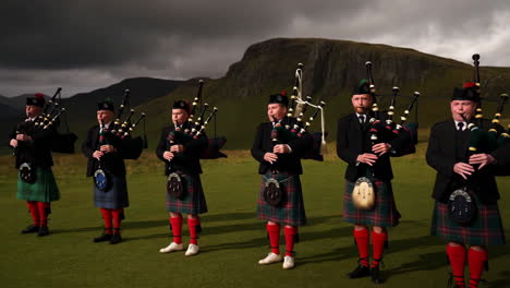 scottish bagpipers in traditional kilts playing outdoors