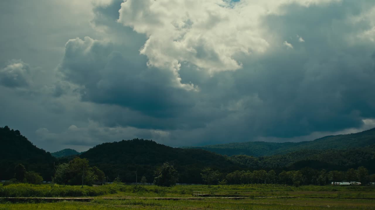 Stormy Clouds over Hills and Fields