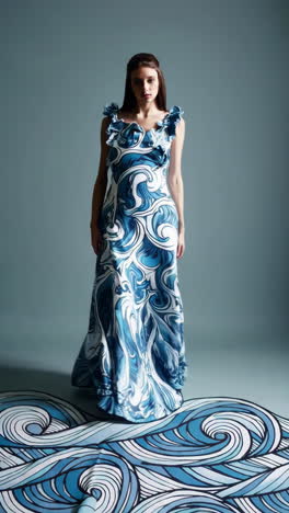 woman modeling an elegant blue and white wave pattern gown