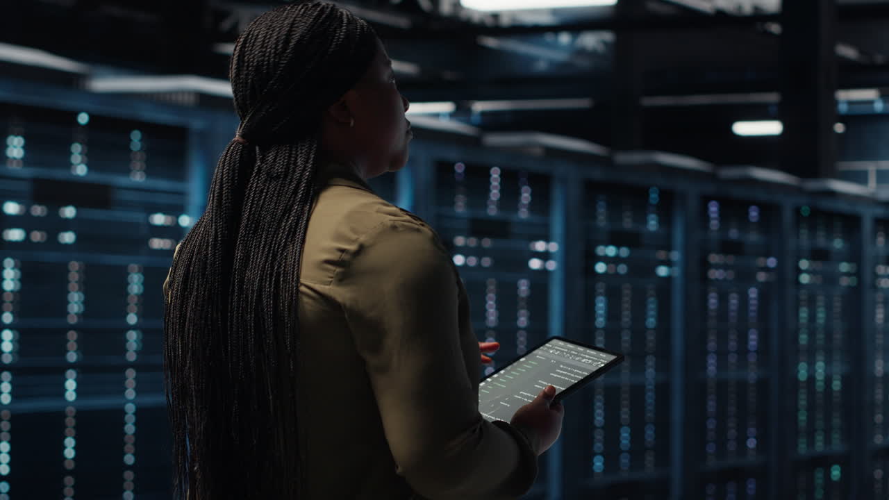 Close up of data center programmer doing data analysis on tablet