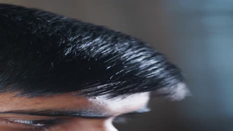 close-up of a person combing their hair