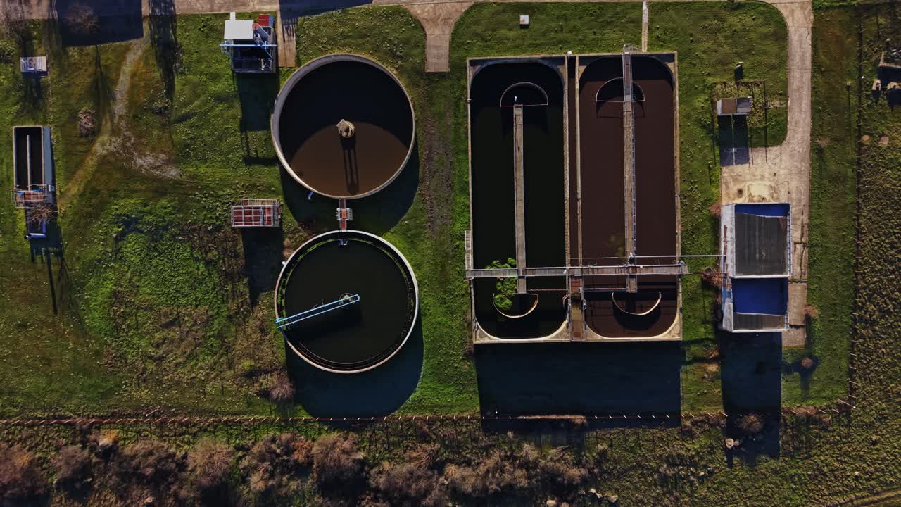 Water treatment facility showing tanks and processing systems in operation