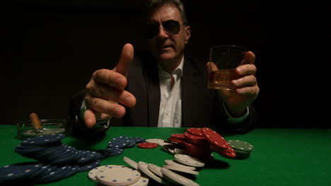 Cool-gambler-pushing-his-chips-over