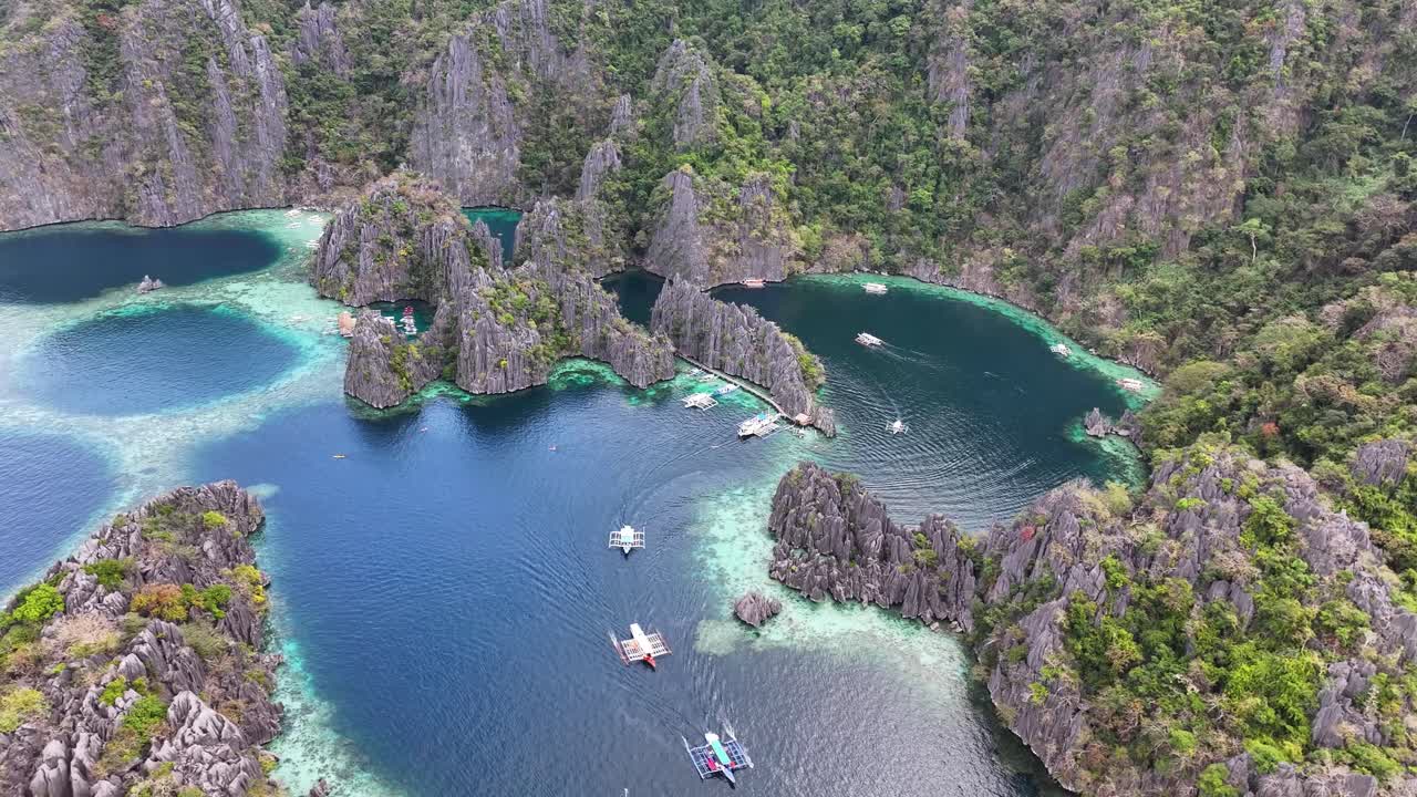 Aerial view of Twin Lagoon, Coron, Philippines. Natural wonder, sharp cliffs, pristine waters.