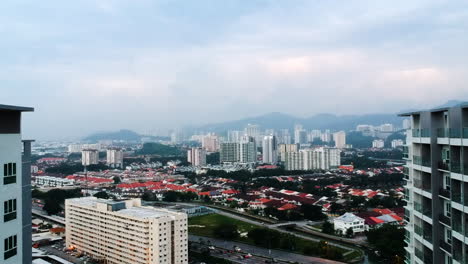 metropole city penang malaysia skyscraper high building dronevideo with view over many houses