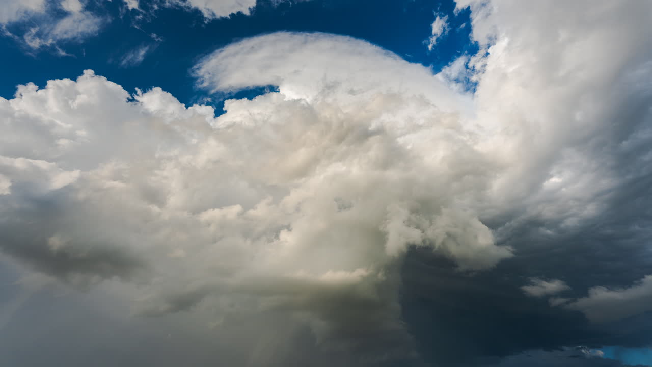 Moody dramatic sky filled with thick storm clouds revealing the raw power of nature