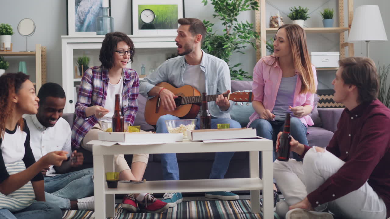 Friends Enjoying Music and Food at Home