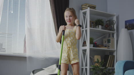 happy little girl having fun singing and dancing