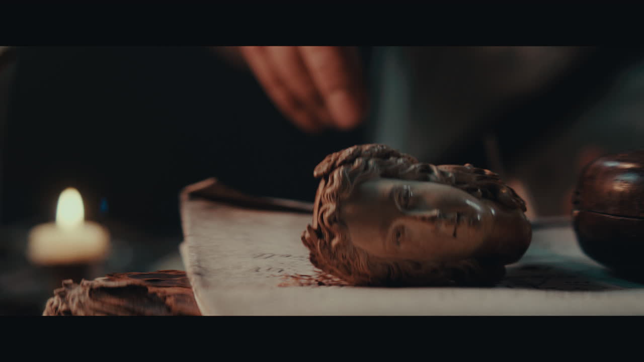 An old pirate capitan smokes a pipe inside the sailing ship cabin