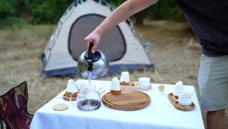 camping breakfast with tea and cupcakes