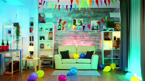 party decorated room with neon lights on the wall and a disco ball