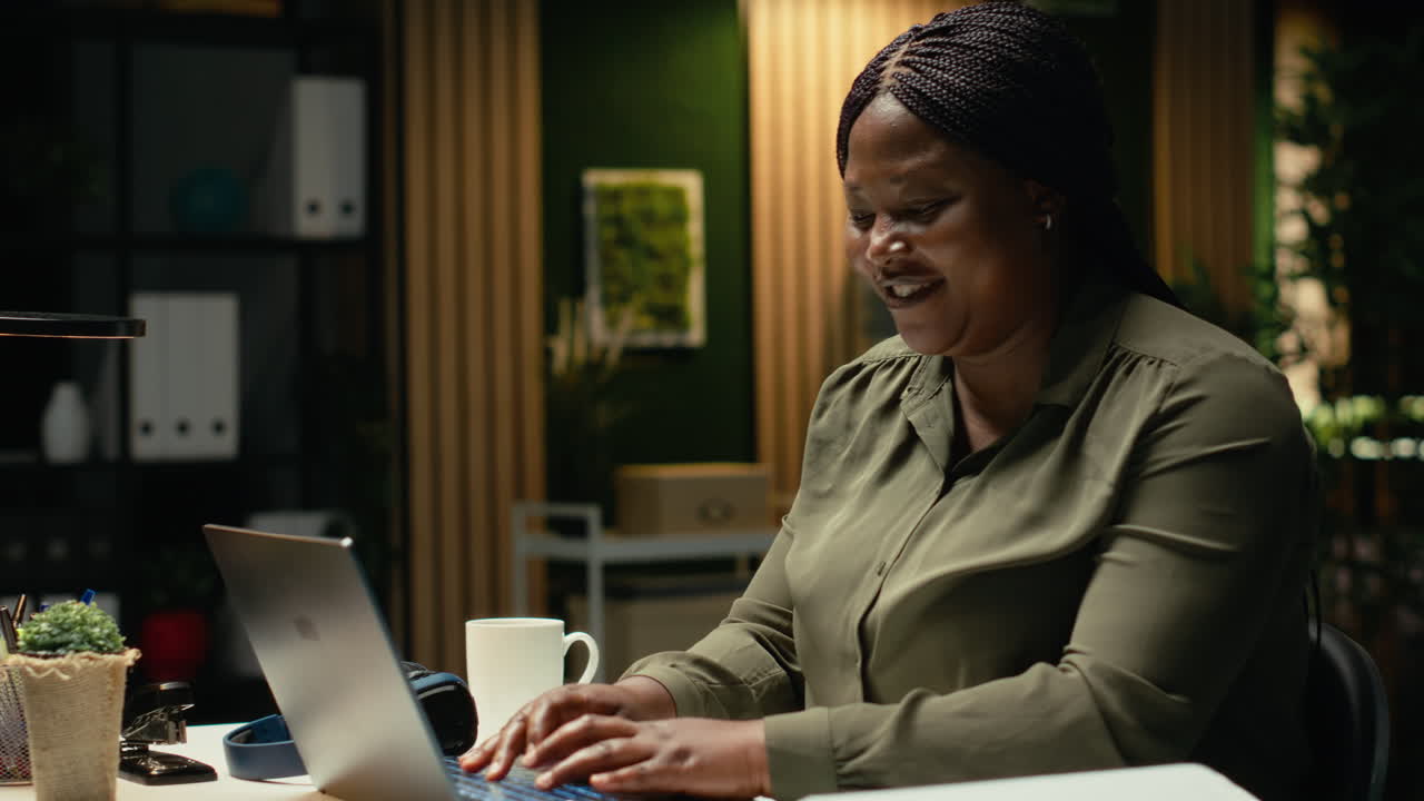 African american analyst reading emails and managing administrative tasks