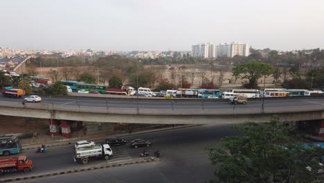 wide angle panning motion lapse of traffic in kr puram, bengaluru, india during day time