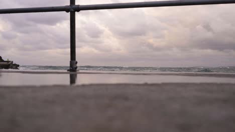 view from the newquay harbour of ocean waves coming during storm alex in the uk