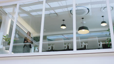 beautiful-business-woman-looking-out-office-window-arms-crossed-enjoying-corporate-leadership-young-female-entrepreneur-planning-ahead-for-future-4k-footage