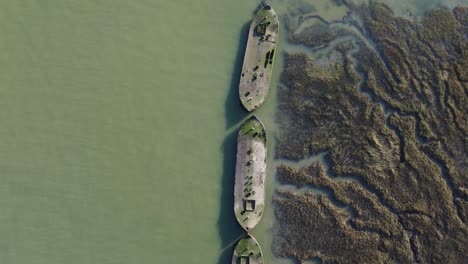 a top down view of barges in the river medway on a sunny winter afternoon