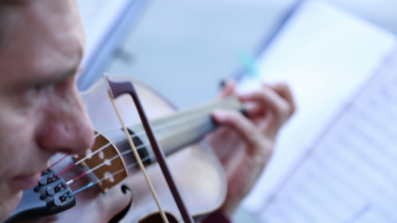 Closeup of a violinist playing the violin