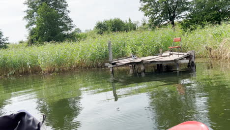 destroyed small wooden pier on the lake