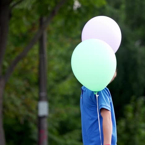 little boy with balloons