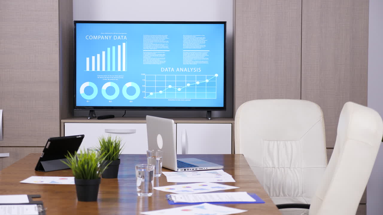 Conference Room with Business Charts and Technology