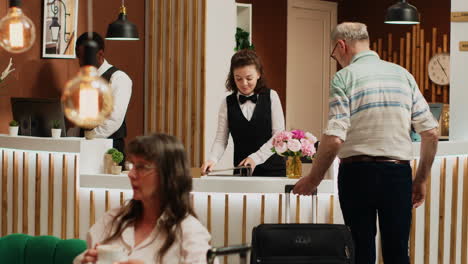 hotel guest does check in at front desk