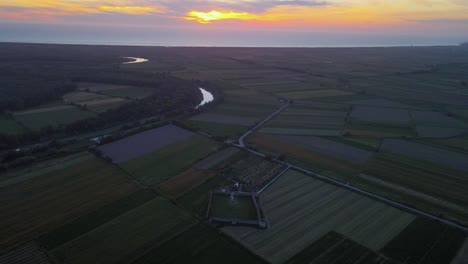 An-evening-with-the-reddish-cloud-and-the-Fortress-of-bashtove-makes-an-historical-recall-of-the-time,-Drone-view,-Albania