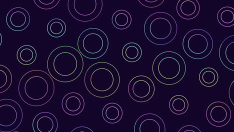 Vibrant floating circles in shades of purple, pink, and blue on black background