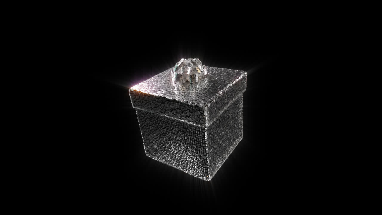 Boîte cadeau argentée scintillante avec un nœud en diamant en rotation.