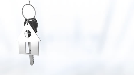 Animation-of-silver-house-keys-hanging-against-blurred-background-with-copy-space