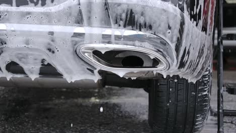 Foamy-Soap-Suds-Dripping-From-Car-Being-Washed-At-Carwash