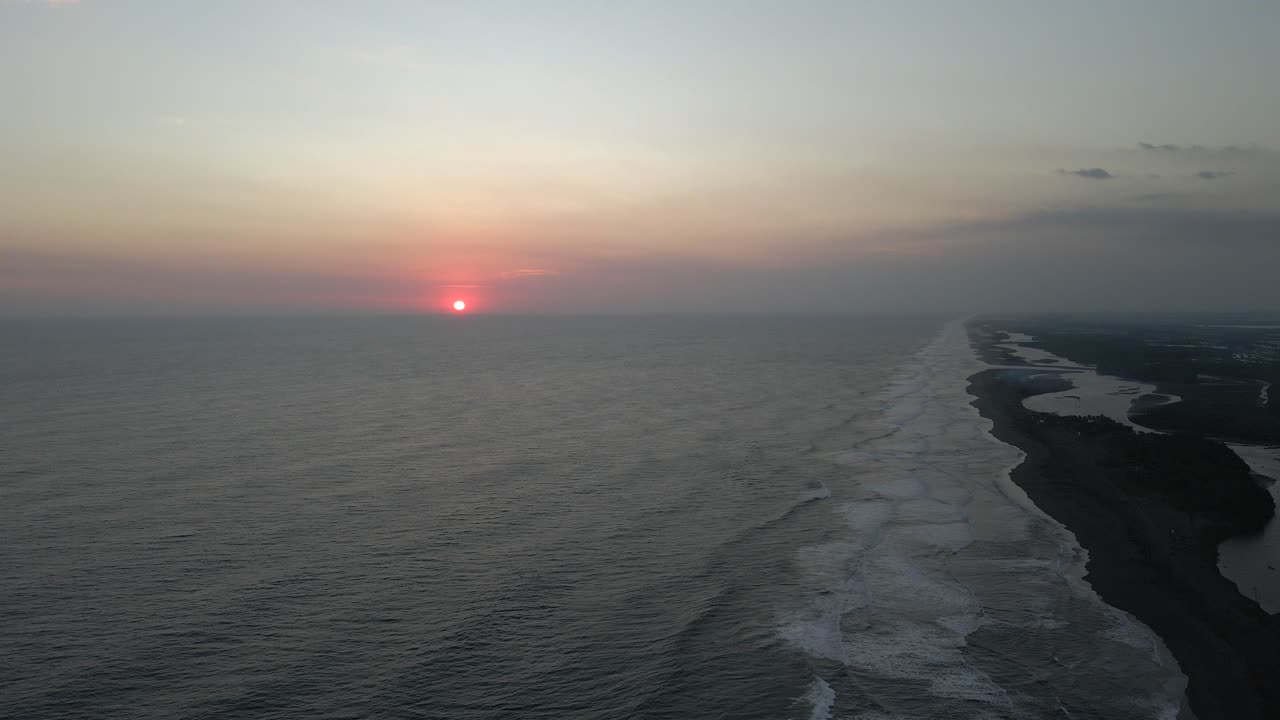 Beautiful sunset aerial drone landscape Guatemala sun over Pacific Ocean coast