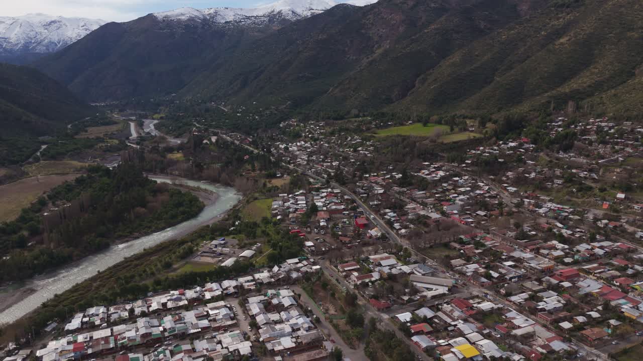 Aerial View of a Town in a Mountain Valley with a River