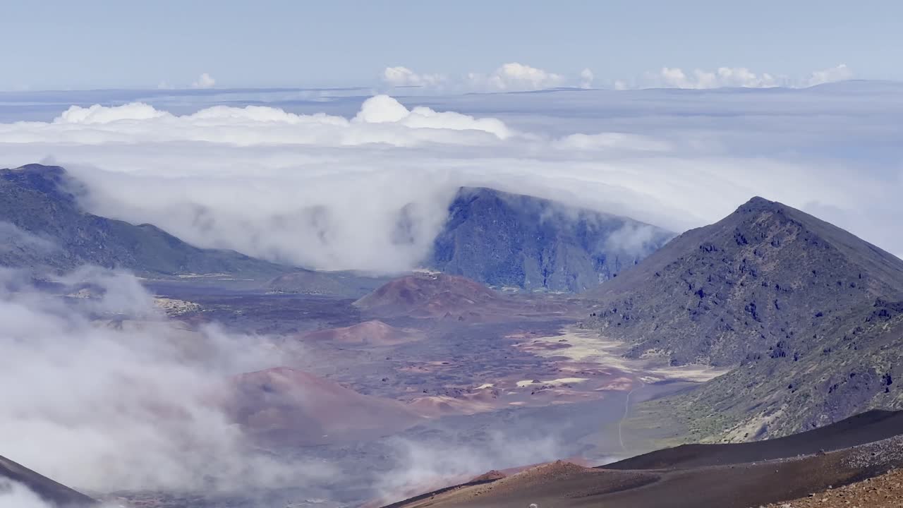 Cinematic panning shot of the volcanic crater at the summit of Haleakala in Maui, Hawai'i