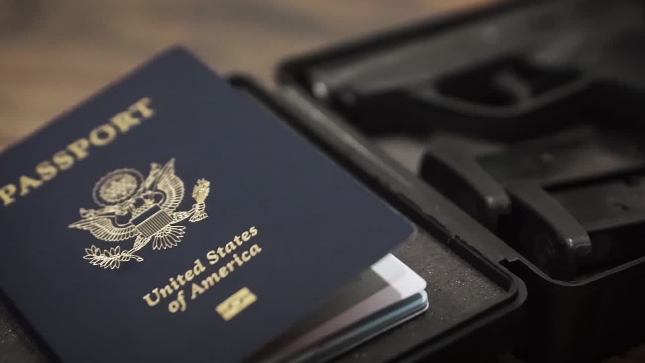 Gun and passport panning shot in foam hardcase
