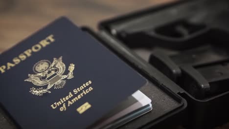 gun and passport panning shot in foam hardcase