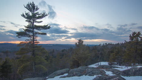 Blazing-red-sunset-tim-lapse-set-in-a-forest-in-late-winter