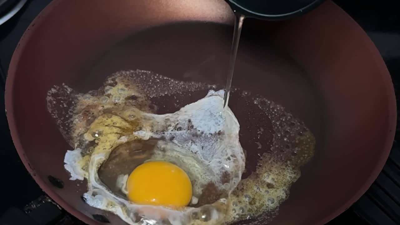Slow motion, delicious gourmet food, frying pan non-stick, oil sizzle