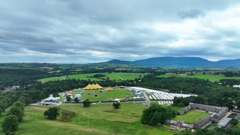ireland drone flying over festival site in curraghmore waterford in the shadow of the comeragh mountains