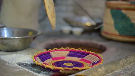 Man-Making-naan-in-a-tandoor-oven