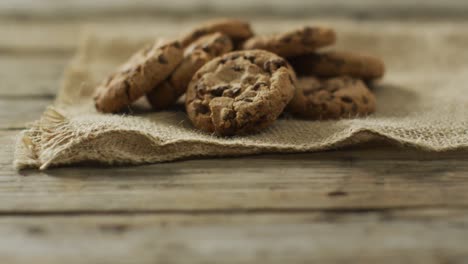 video of biscuits with chocolate on wooden background