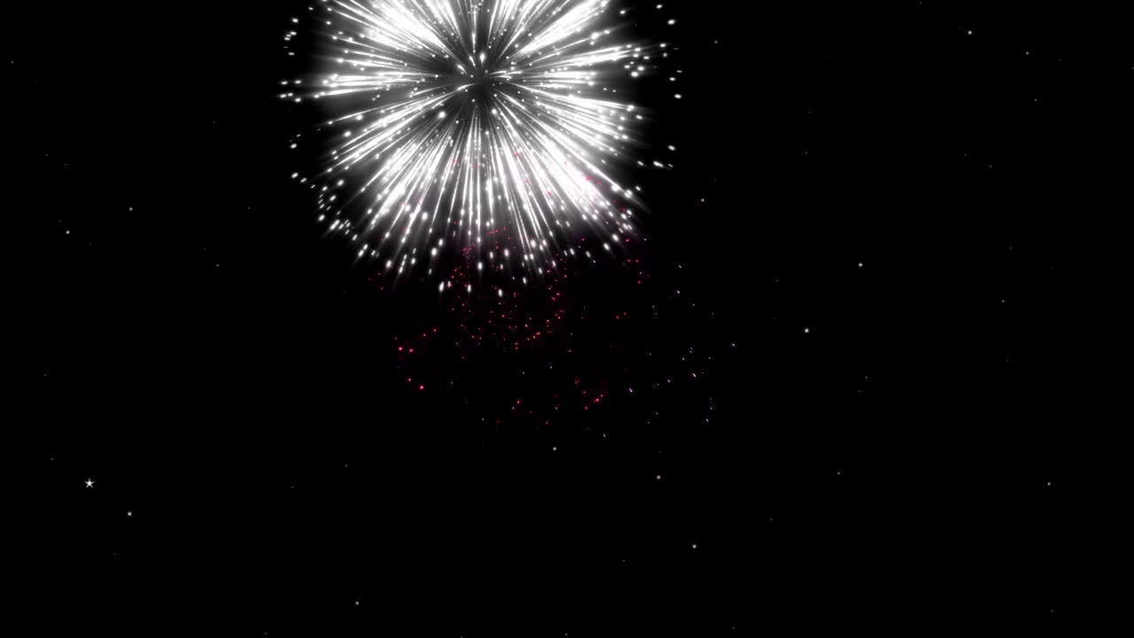 Firework display at night on black background. Bright glaring red green yellow explosions. Amazingly beautiful. Salute for new year Christmas and other holidays